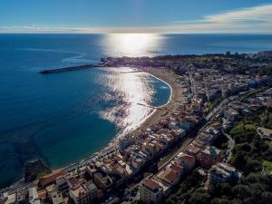 an aerial view of a beach and the ocean at Ludovica Home in Giardini Naxos