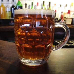 a mug of beer sitting on a table at The Hundred of Ashendon in Waddesdon