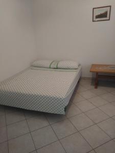 Postel nebo postele na pokoji v ubytování Apartments Soljacic