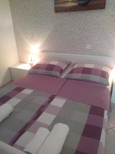 Postel nebo postele na pokoji v ubytování Apartments Soljacic
