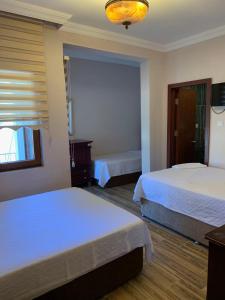 Voodi või voodid majutusasutuse Adrasan La Casita Hotel toas