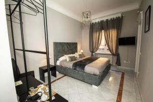 Ένα ή περισσότερα κρεβάτια σε δωμάτιο στο Compasso Suites