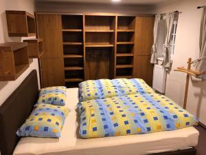a bedroom with a bed and two pillows at Cibulka in Horní Malá Úpa