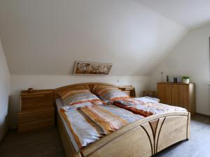 a bedroom with a bed with a wooden frame at Helle moderne 52 qm Wohnung mit Balkon in Chemnitz