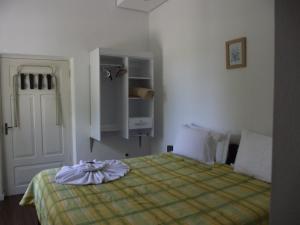 Ένα ή περισσότερα κρεβάτια σε δωμάτιο στο Pousada Max Pomerode