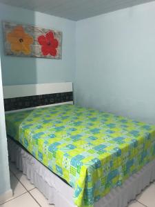 Katil atau katil-katil dalam bilik di Casa praia frente ao mar