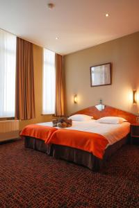 Letto o letti in una camera di Hotel Grupello
