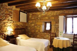 Postel nebo postele na pokoji v ubytování Casa Velarde