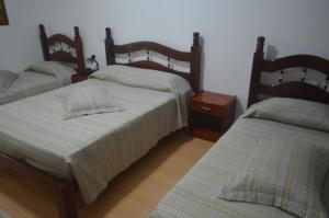 
A bed or beds in a room at Hotel Obino São Borja
