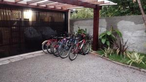 a group of bikes parked next to a fence at POUSADA LOS AMIGOS CAMPECHE in Florianópolis