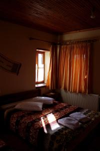 Postel nebo postele na pokoji v ubytování To Petrino Guesthouse
