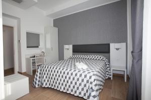 Postel nebo postele na pokoji v ubytování Guesthouse Porto di Roma