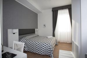 Postel nebo postele na pokoji v ubytování Guesthouse Porto di Roma