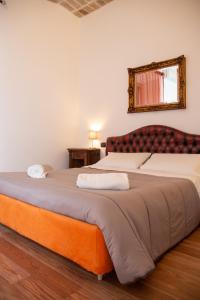 Postel nebo postele na pokoji v ubytování Dillo Suites