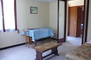 a room with a table with a blue table cloth on it at Villa NORICA in Bordezac