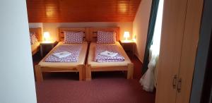 Katil atau katil-katil dalam bilik di Hotel Rohanov