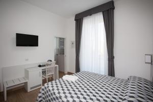 Postel nebo postele na pokoji v ubytování Guesthouse Porto di Roma