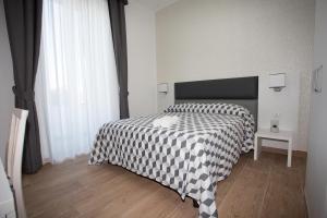 Postel nebo postele na pokoji v ubytování Guesthouse Porto di Roma
