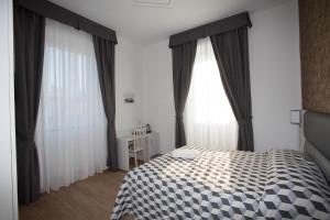 Postel nebo postele na pokoji v ubytování Guesthouse Porto di Roma