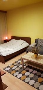 A bed or beds in a room at Obuda Apartment