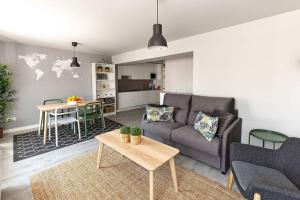 a living room with a couch and a table at TOCANDO EL CIELO in Burgos