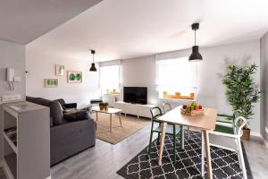 a living room with a couch and a table at TOCANDO EL CIELO in Burgos