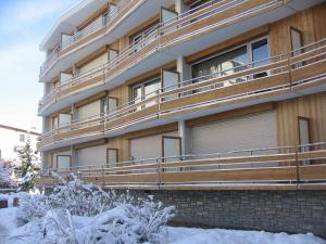 a apartment building with snow in front of it at 2 Alpes-locations Studio 4 personnes in Les Deux Alpes