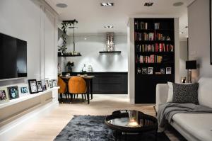 a living room with a couch and a table at City Rent Apartments in Łódź