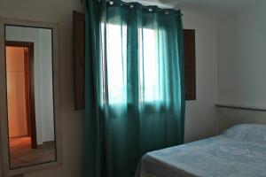 Ліжко або ліжка в номері La PAVONCELLA sul MARE