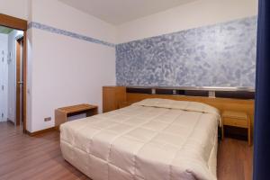 Postel nebo postele na pokoji v ubytování Park Hotel
