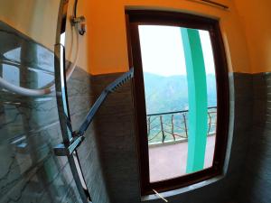 a window in a room with a view at Ella Ravana Seetha Mountain View Villa in Ella