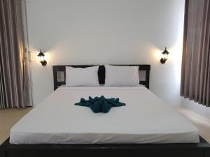 Postel nebo postele na pokoji v ubytování Talent Resort