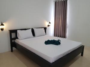 Postel nebo postele na pokoji v ubytování Talent Resort