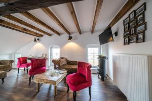 TV a/nebo společenská místnost v ubytování OSTLAND LOFT im INSEL-LAND-HOTEL MICHAELSEN