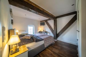 Postel nebo postele na pokoji v ubytování OSTLAND LOFT im INSEL-LAND-HOTEL MICHAELSEN