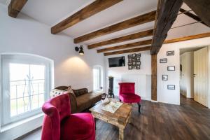 Posezení v ubytování OSTLAND LOFT im INSEL-LAND-HOTEL MICHAELSEN