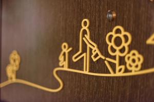 a group of symbols on a wooden door at Sojourn Spa Hotel Ipoh in Ipoh