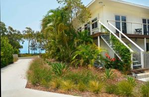 a house with a balcony and a walkway at 545 Esplanade in Hervey Bay