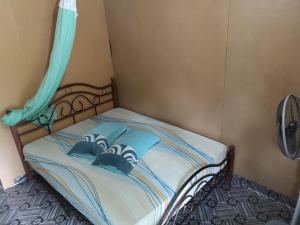Postelja oz. postelje v sobi nastanitve Puteri Salang Inn