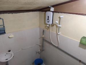 a bathroom with a toilet and a sink at Puteri Salang Inn in Tioman Island