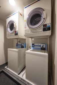 two washers and dryers on display in a store at UNPLAN Village Hakuba in Otari