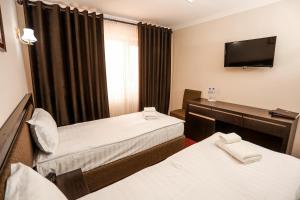 Sugdiyon Hotel客房内的一张或多张床位