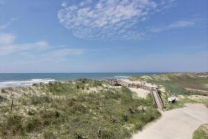 a view of the ocean from the top of a beach at NC 12 56821-29 Condo in Hatteras