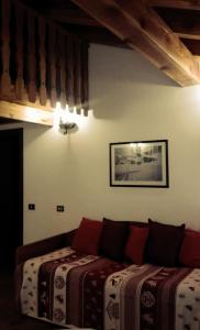 En eller flere senger på et rom på Residence Casa dei Fiori