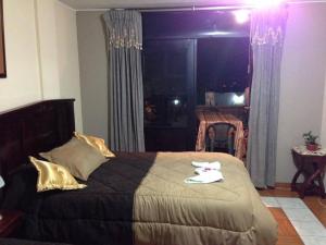 Postel nebo postele na pokoji v ubytování Hostal Jora Continental