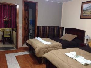 Postel nebo postele na pokoji v ubytování Hostal Jora Continental