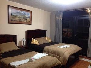 Postel nebo postele na pokoji v ubytování Hostal Jora Continental