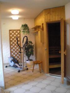 a room with a wooden floor and a wooden door at Hotel Garni Stadt Friedberg in Friedberg