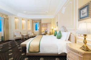 A bed or beds in a room at Harbourview Hotel Macau