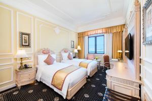 Postel nebo postele na pokoji v ubytování Harbourview Hotel Macau